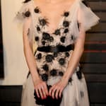 Emma Roberts poses on the red carpet at the Vanity Fair Oscar Party in LA