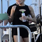 Miley Cyrus wears a black cutout romper and sips a coconut water as she heads to rehearsal for her New Year apos s Eve show in Miami