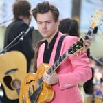 Harry Styles performs on the "Today Show" in New York City wearing pink suit.