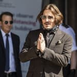Actor Johnny Depp arrives at the High court in London as the legal action against The Sun newspaper continues.