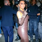 Kim Kardashian flashing a peace sign