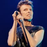 Pop star David Bowie performing on stage during a concert at The Scottish Exhibition and Conference Centre (SECC) in Glasgow.