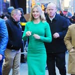 Emily Blunt looks stunning in an emerald bodycon dress as she stops by the GMA