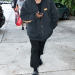 Kanye West is seen for the first time since becoming legally single as he hits up a tattoo shop in Miami