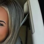 Emily Elizabeth takes a selfie inside her car.