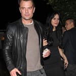 Josh Duhamel holds hands with Audra Mari as they leave a house party together