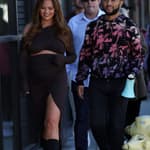 Chrissy Teigen looks radiant as she and husband John Legend help out behind the counter on the 'Cravings, By Chrissy Teigen' food truck in Beverly Hills.