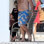 Vanderpump Rules star Lala Kent relaxes in black sweats while shirtless husband Randall Emmett takes a boat ride during their Miami vacation