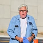 Jay Leno stops by a gas station in yet another cool car after getting out of the hospital yesterday