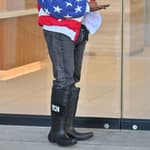 Kanye West heads to a meeting after heading to church wearing an American flag jacket