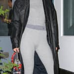 Gigi Hadid poses while arriving at the popup store of her Guest in Residence brand in New York City