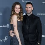 Behati Prinsloo and husband Adam Levine arrive at the Baby2Baby 10-Year Gala 2021