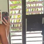 Larissa Trownson poses in a yellow bikini