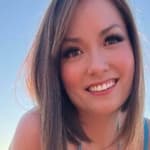 Nikole Mitchell poses in a blue bikini