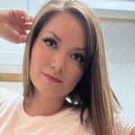 Nikole Mitchell poses in panties and a white shirt