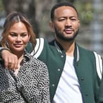 John Legend and Chrissy Teigen watch their kid play baseball
