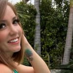 Nikole Mitchell in a green bikini