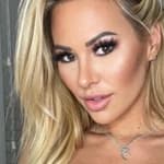 Kindly Myers in a blue sports bra