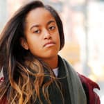 Malia Obama heads to work in New York wearing a red jacket and a super long scarf