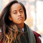 Malia Obama heads to work in New York wearing a red jacket and a super long scarf