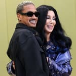 Alexander Edwards and girlfriend Cher arrive at the Versace Fall/Winter 2023 Fashion Show