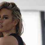 Kindly Myers poses in a black thong