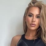Kindly Myers in a black sports bra and leggings
