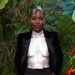 Lupita Nyong'o tries some crunchy grasshoppers