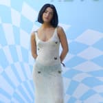 Tik Tok Star Charli D'Amelio in White Knit Dress with Butterfly Appliques and Heavy Boots at Revolve Festival In Palm Springs. 13 Apr 2024 Pictured: Tik Tok Star Charli D'Amelio in White Knit Dress and Heavy Boots at Revolve Festival. Photo credit: Tim Regas / MEGA TheMegaAgency.com +1 888 505 6342 (Mega Agency TagID: MEGA1123989_007.jpg) [Photo via Mega Agency]