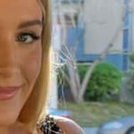 Genie Bouchard poses for the camera.