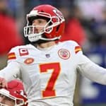 Harrison Butker kicking the football
