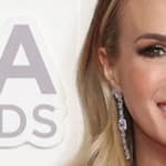 Carrie Underwood smiles at an event