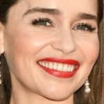 Emilia Clarke poses smiling