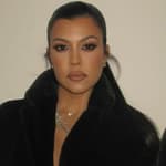 Kourtney Kardashian photographed wearing a black robe after the birth of son Rocky.