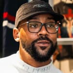 A portrait of Marcus Jordan wearing glasses