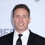 Chris Cuomo smiles in a black tux