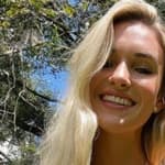 Kayla Simmons smiles at the camera.