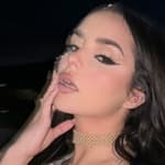 Demi Rose poses for the camera.