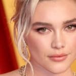 Florence Pugh poses at an event