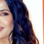 Salma Hayek smiles at an event