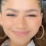 Zendaya smiling from her car