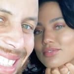 Ayesha and Steph Curry pose for a photo