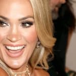 Carrie Underwood laughs at an event