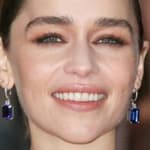 Emilia Clarke poses smiling