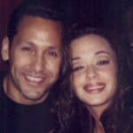 A photo of Leah Remini and husband Angelo Pagán smiling