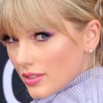 Taylor Swift poses an an event