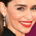 Emilia Clarke poses smiling