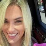 Kayla Simmons flashes a big smile in a selfie.
