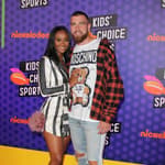 Kayla Nicole and Travis Kelce on the orange carpet