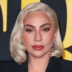 Lady Gaga wearing an Alexander McQueen suit arrives at the Los Angeles Special Screening Of Netflix's 'Maestro'